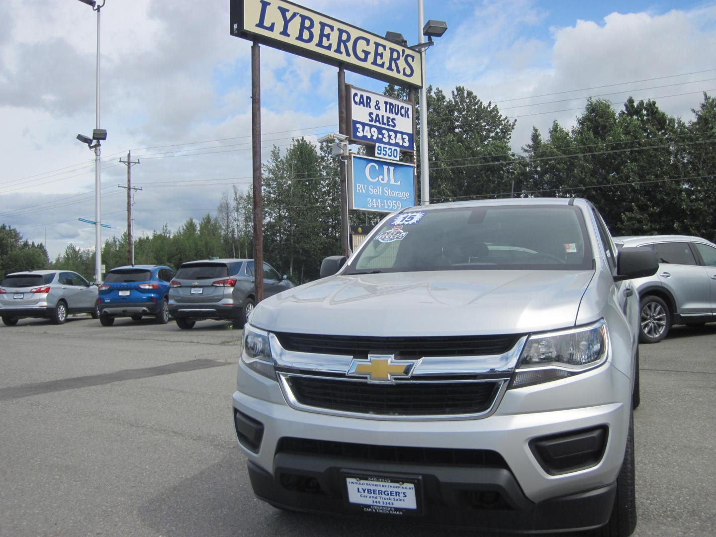 2015 silver /gray Chevrolet Colorado WT Ext. Cab 4WD (1GCHTAEAXF1) with an 2.5L L4 DOHC 16V GAS engine, 6-Speed Automatic transmission, located at 9530 Old Seward Highway, Anchorage, AK, 99515, (907) 349-3343, 61.134140, -149.865570 - Photo#1