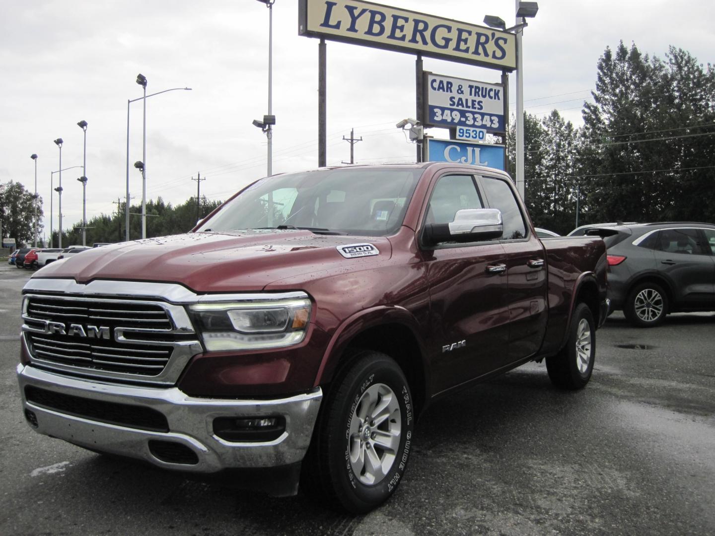 2020 Maroon /black RAM 1500 Laramie Quad Cab 4WD (1C6SRFDT7LN) with an 3.6L V6 FFV engine, 8A transmission, located at 9530 Old Seward Highway, Anchorage, AK, 99515, (907) 349-3343, 61.134140, -149.865570 - Nice Ram 1500 Laramie quad cab come take a test drive - Photo#0