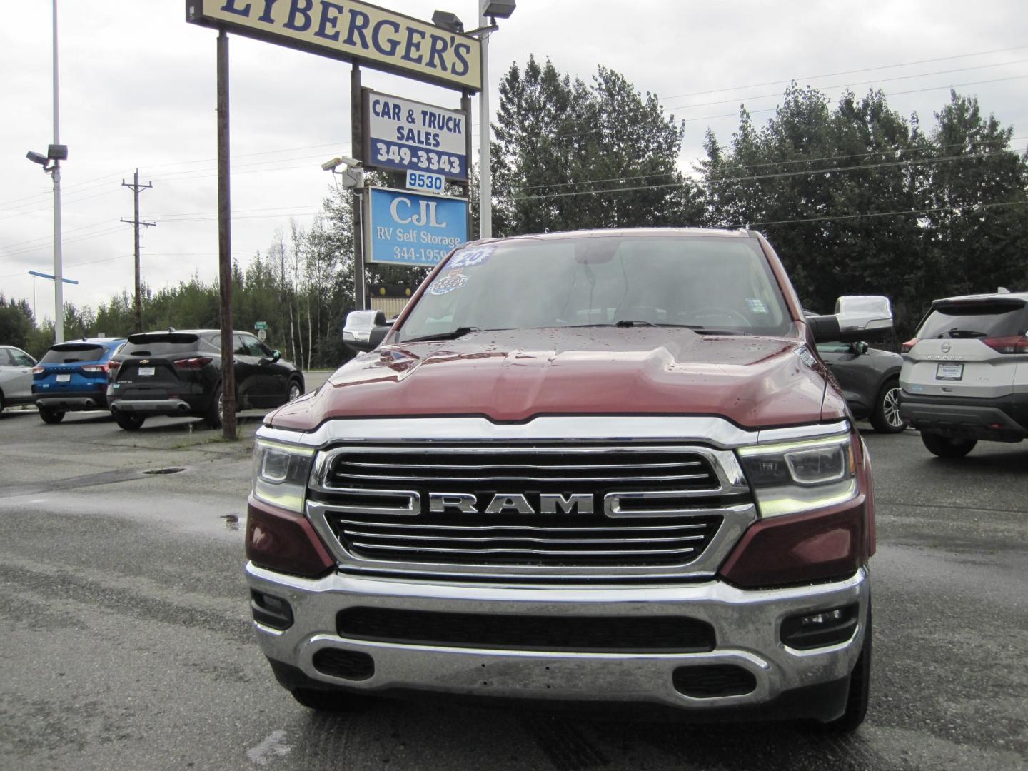 2020 Maroon /black RAM 1500 Laramie Quad Cab 4WD (1C6SRFDT7LN) with an 3.6L V6 FFV engine, 8A transmission, located at 9530 Old Seward Highway, Anchorage, AK, 99515, (907) 349-3343, 61.134140, -149.865570 - Nice Ram 1500 Laramie quad cab come take a test drive - Photo#1